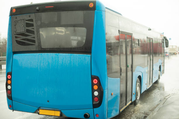 istock Bus on road. Blue bus pulls away from station. 1478103017
