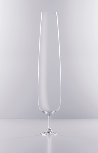 Oversized wine glass on gray background