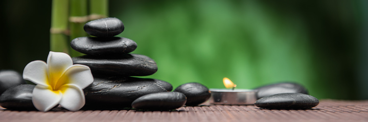 Young woman gets Thai head massage at spa salon. Warm inviting styling. Calm atmosphere. Copy space. Close-up