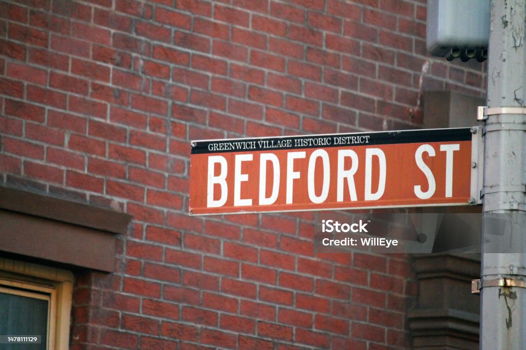 Bedford Street historic sign in Midtown Manhattan in New York City historic sign in Midtown Manhattan in New York City in Greenwich Village Historic District Bedford Street historic sign in Midtown Manhattan in New York City Arrow Symbol Stock Photo
