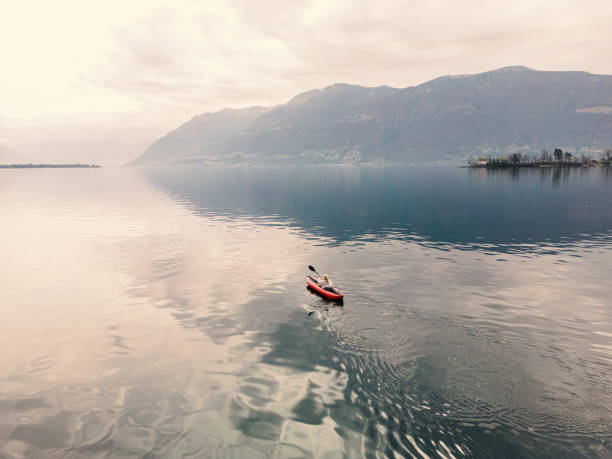 istock Aerial view, woman canoeing on lake 1478112614