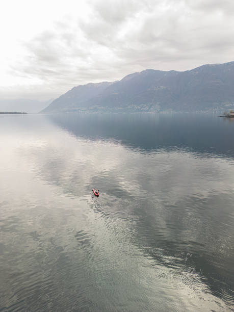 istock Aerial drone, distant person canoeing on lake 1478112854
