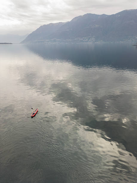 istock Aerial drone, distant person canoeing on lake 1478113049