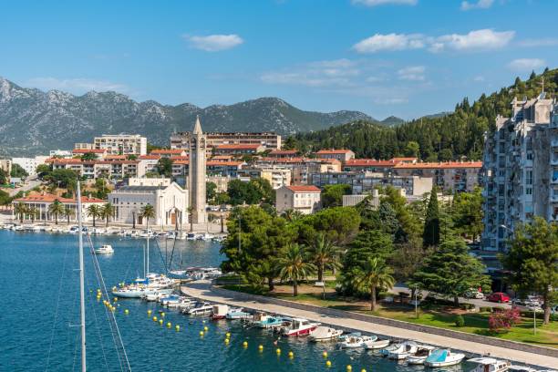 picturesque view of a harbor featuring several boats docked in the water. ploce, croatia. - ploce imagens e fotografias de stock