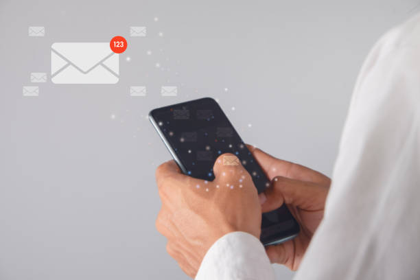 istock Businessman hand using smartphone with email icon. communication concept. 1478116377