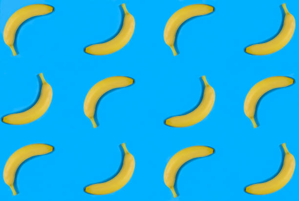 istock Banana on the blue background. Flat lay. Pattern. Top view. 1478119137