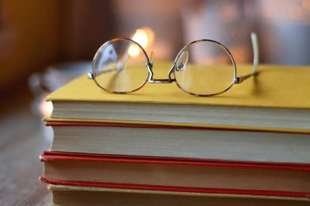 istock Books, Glasses, E-Reader, Pen, Tea, Cookies and Candles 1478121261