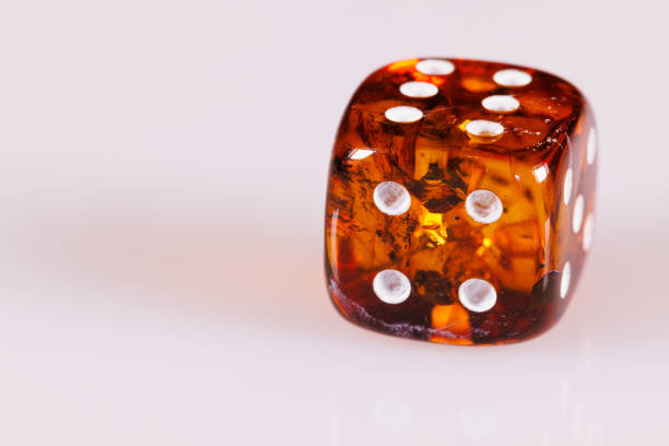 Many red game dices on green background, closeup