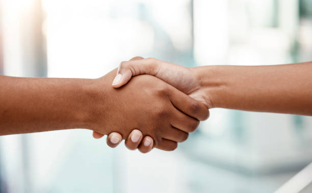 istock Handshake, interview and human resources manager networking with a businessman in an office building. We are hiring, diversity and business people shaking hands after a successful negotiation meeting 1478125227