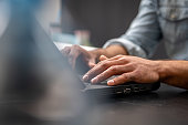 Mans hands using laptop