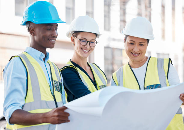 istock Planning, construction and architects with a blueprint for building, engineering and vision for industrial project. Teamwork, design and creative employees with paper for architecture on a site 1478126933