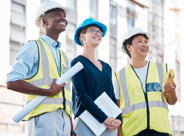 istock Architect, engineer and happy with building development, strategy and teamwork for property success on construction site. Contractor, Real estate agent and engineering expert smile at architecture work project 1478126934