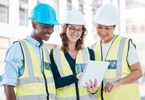 istock Architect, team and tablet in city construction for building inspection, collaboration or idea for architecture. Engineering people working on touchscreen with smile in teamwork design or site plan 1478126936
