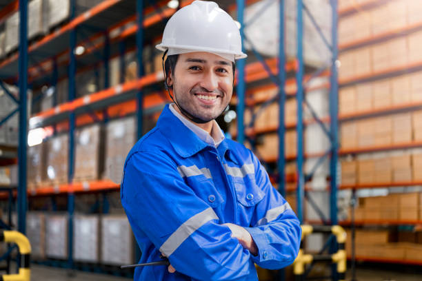 istock smart man worker wearing working suite dress and safety helmet at cargo for stack item for shipping.female worker checking the store factory. industry factory warehouse. Inspection quality control. 1478129211