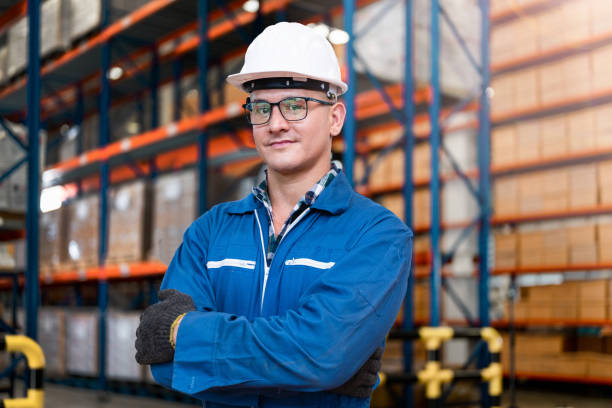 istock smart man worker wearing working suite dress and safety helmet at cargo for stack item for shipping.female worker checking the store factory. industry factory warehouse. Inspection quality control. 1478129341