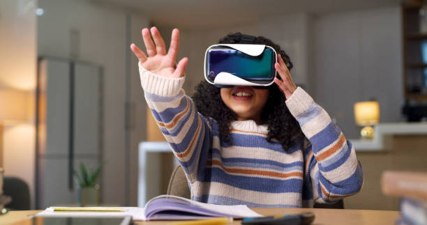 istock VR glasses, online learning and child in metaverse, futuristic high tech and 3d user experience at home. Virtual reality, digital world and girl kid with night education, video games and teaching app 1478130195