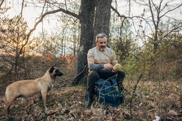 istock A man walks his dog in nature, lunch break 1478130392