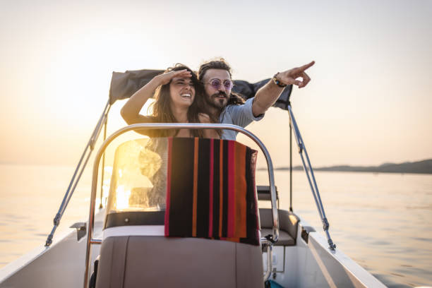 istock Couple enjoying a leasure boat trip 1478131624