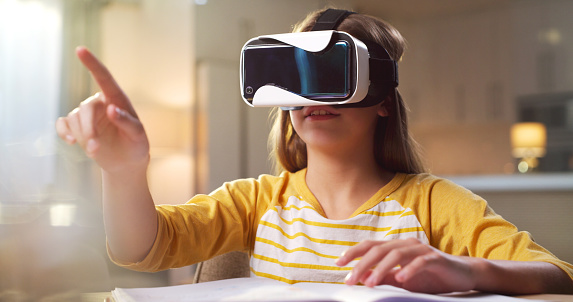 VR glasses of teenager child with home metaverse experience, futuristic online learning or 3d digital world at night. Virtual reality, high tech education and kid press for video or vision software