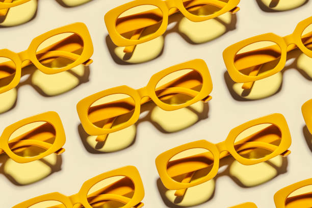 istock Minimal pattern from yellow eyeglasses on beige background, visual trends summer concept. Top view aesthetic photo, colored sunglasses as creative geometric pattern, monochrome flat lay glasses 1478134141