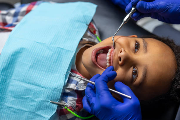 istock African-american boy teeth treatment close up 1478135765