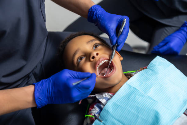 istock African-american boy teeth treatment close up 1478135774