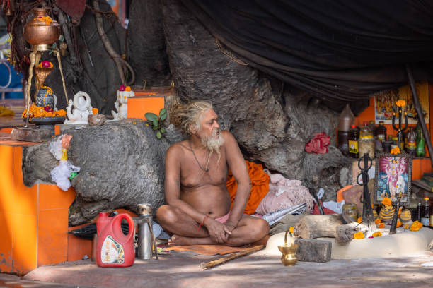 Portrait of old sadhu holy man near river ganges stock photo