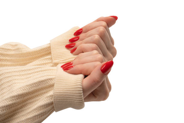 istock Woman hands with red nails isolated on a white background. 1478136415