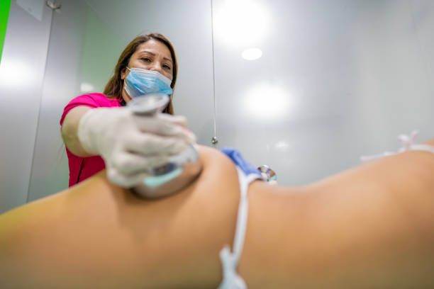 istock Latin woman professional beautician performs lymphatic massages to client 1478136463