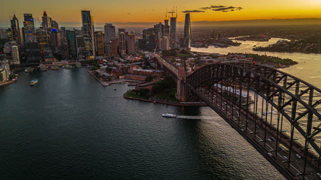4K Aerial view Day to night Hyper lapse Footage of above Sydney Harbour Bridge, Circular Quay and Sydney Daring Habor