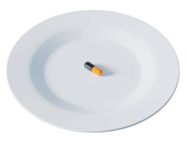 istock Single pill on a white plate, 3d rendering. Nutritional supplement, taking medication, healthcare and wellbeing concept 1478138079