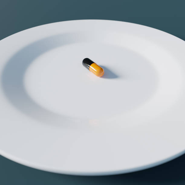 istock Single pill on a white plate, 3d rendering. Nutritional supplement, taking medication, healthcare and wellbeing concept 1478138103