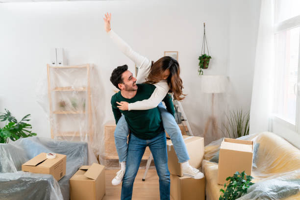 istock Happy couple unpacking boxess at home 1478140074