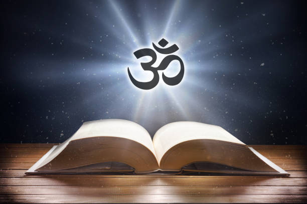 istock Open book on wooden table and hindu symbol front view 1478140372