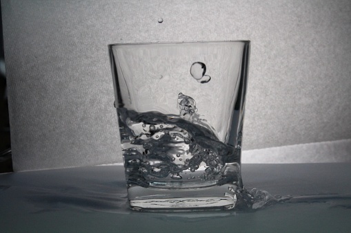 Water poured into glass freeze Frame