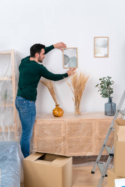 istock Happy couple unpacking boxes at home 1478144238
