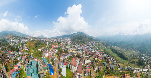 Aerial view of landscape at the hill town in Sapa city, Lao Cai Province, Vietnam in Asia with the sunny light and sunset, mountain view in the clouds. Travel and landscape concept.