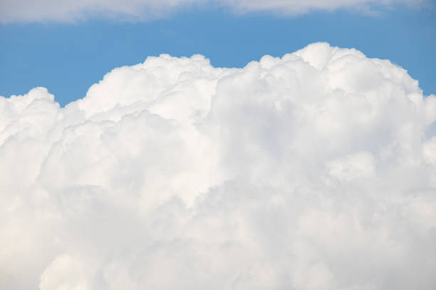 istock cloudy sky on a sunny day as a background close up 1478155372