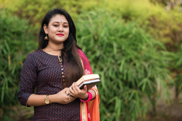 istock Young Indian Female University Student holding books 1478156162