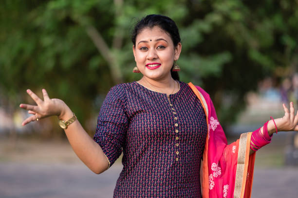 Outdoor portrait of surprised young women gesturing with arms having wide open and big eye with open mouth,