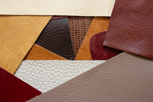 different colors pieces of leather as a background closeup