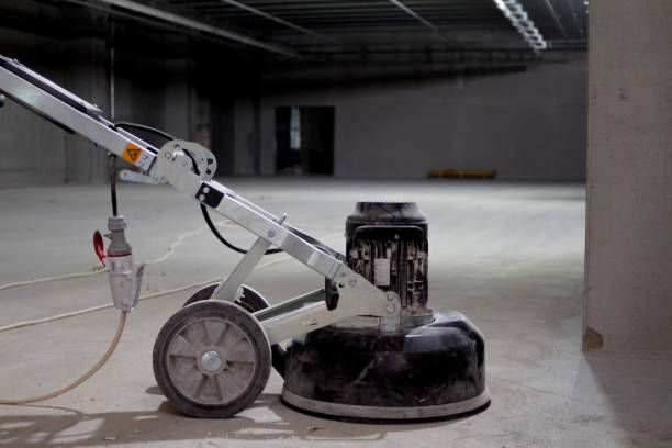 istock concrete floor grinding machine is an essential tool used to prepare the surface of a concrete floor before the installation of a new layer. 1478161383