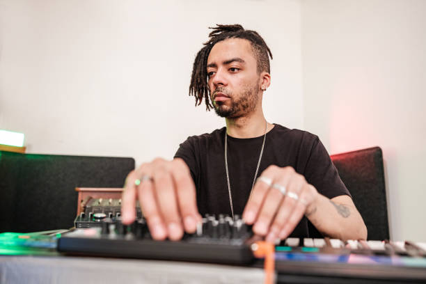 istock Male mixed race Musician practising at home recording studio 1478161487