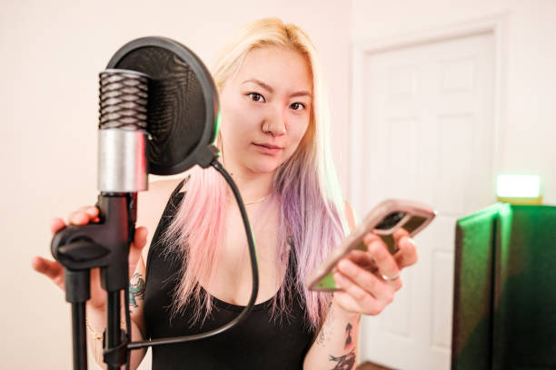 istock Female Korean Musician practising at home recording studio 1478161592
