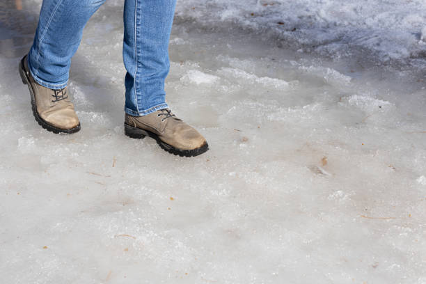 istock man walking on ice in the park 1478163540