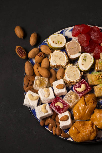 istock A large plate of oriental sweets and nuts on a dark background 1478167475