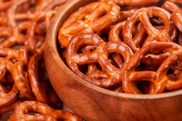 istock Crispy pretzel crackers with salt crystals in wooden bowl 1478167956