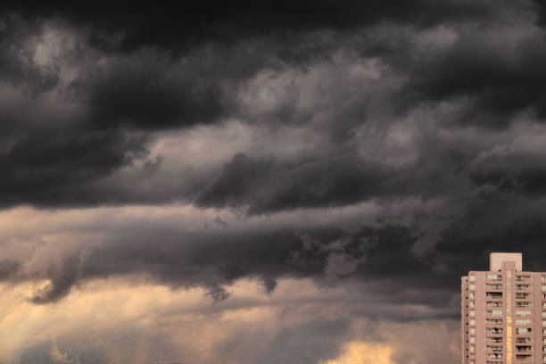 istock dark clouds from a major storm approaching an urban area. 1478169757