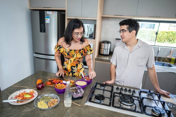 istock Couple cooking at home 1478170521