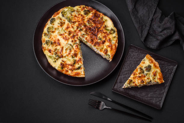 istock Delicious quiche with broccoli, cheese, chicken, spices and herbs 1478174512